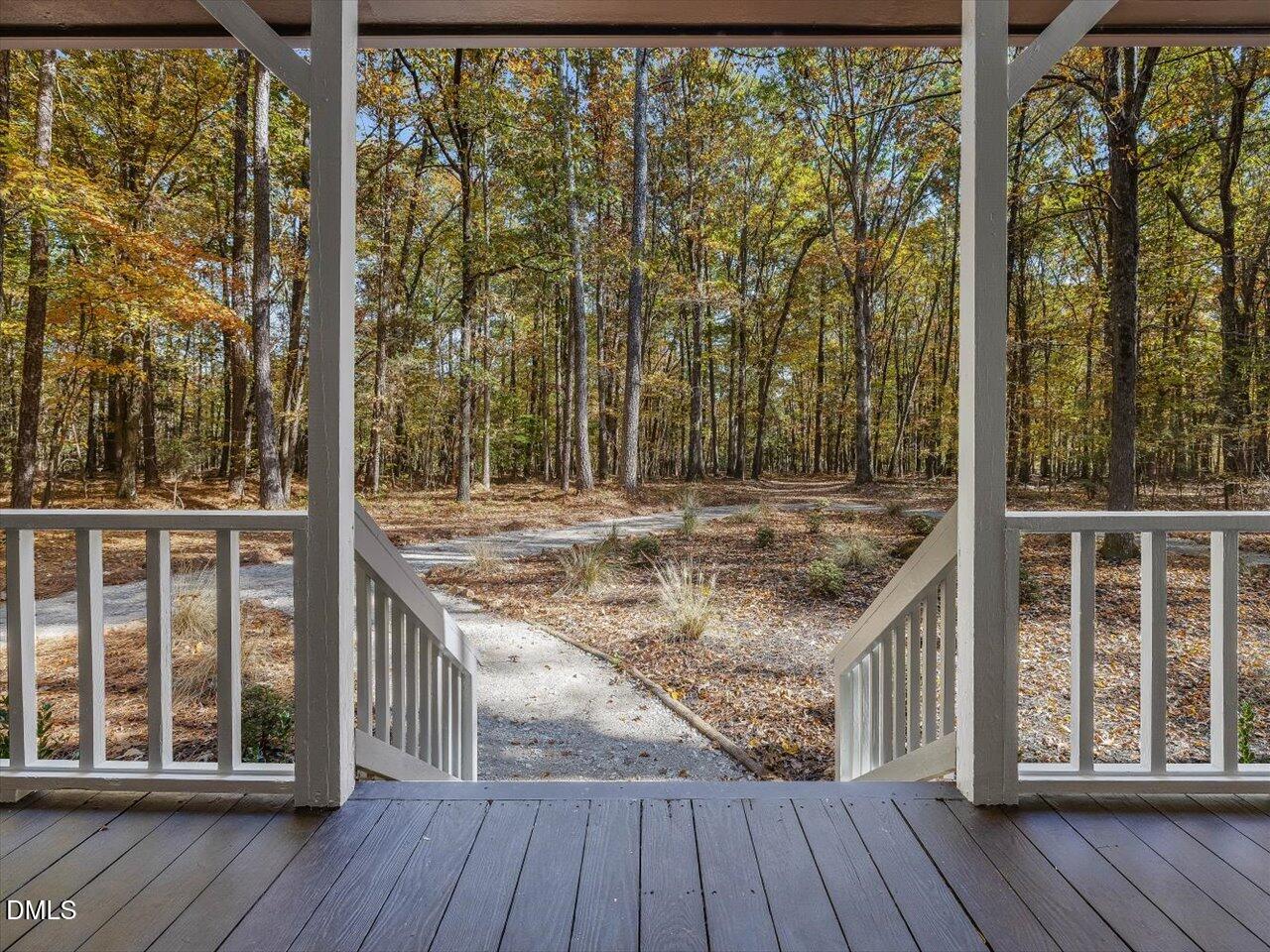 1838 Alex Cockman Road Pittsboro, NC 27312 - Photo 4 of 53 a view of a balcony with wooden floor