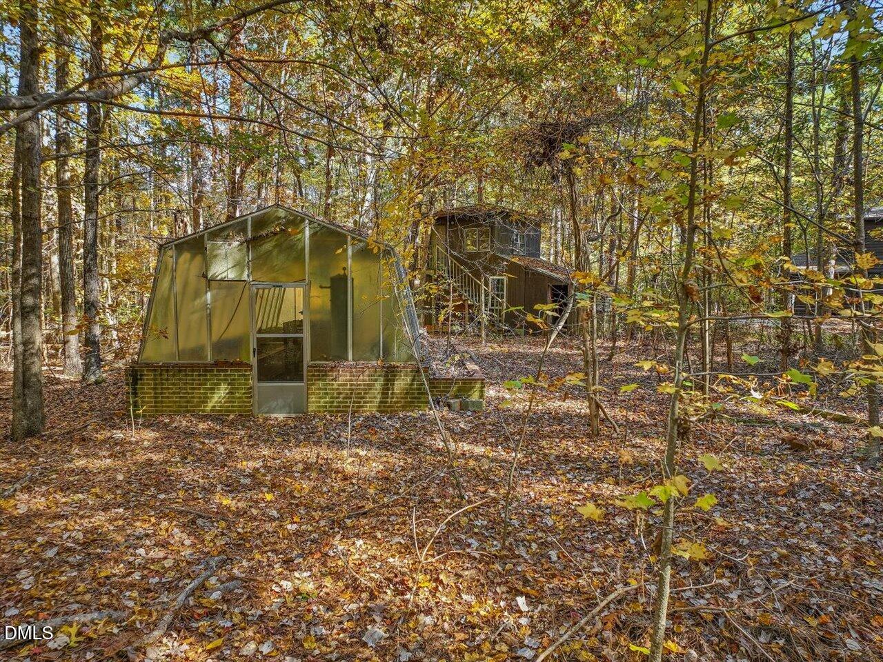 1838 Alex Cockman Road Pittsboro, NC 27312 - Photo 45 of 53 front view of a brick house with a yard
