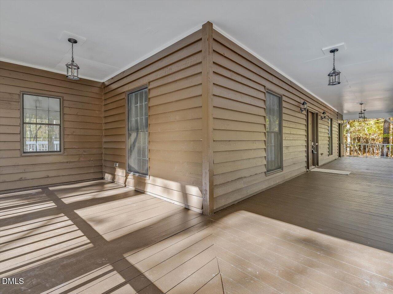 1838 Alex Cockman Road Pittsboro, NC 27312 - Photo 6 of 53 a view of a hallway with windows