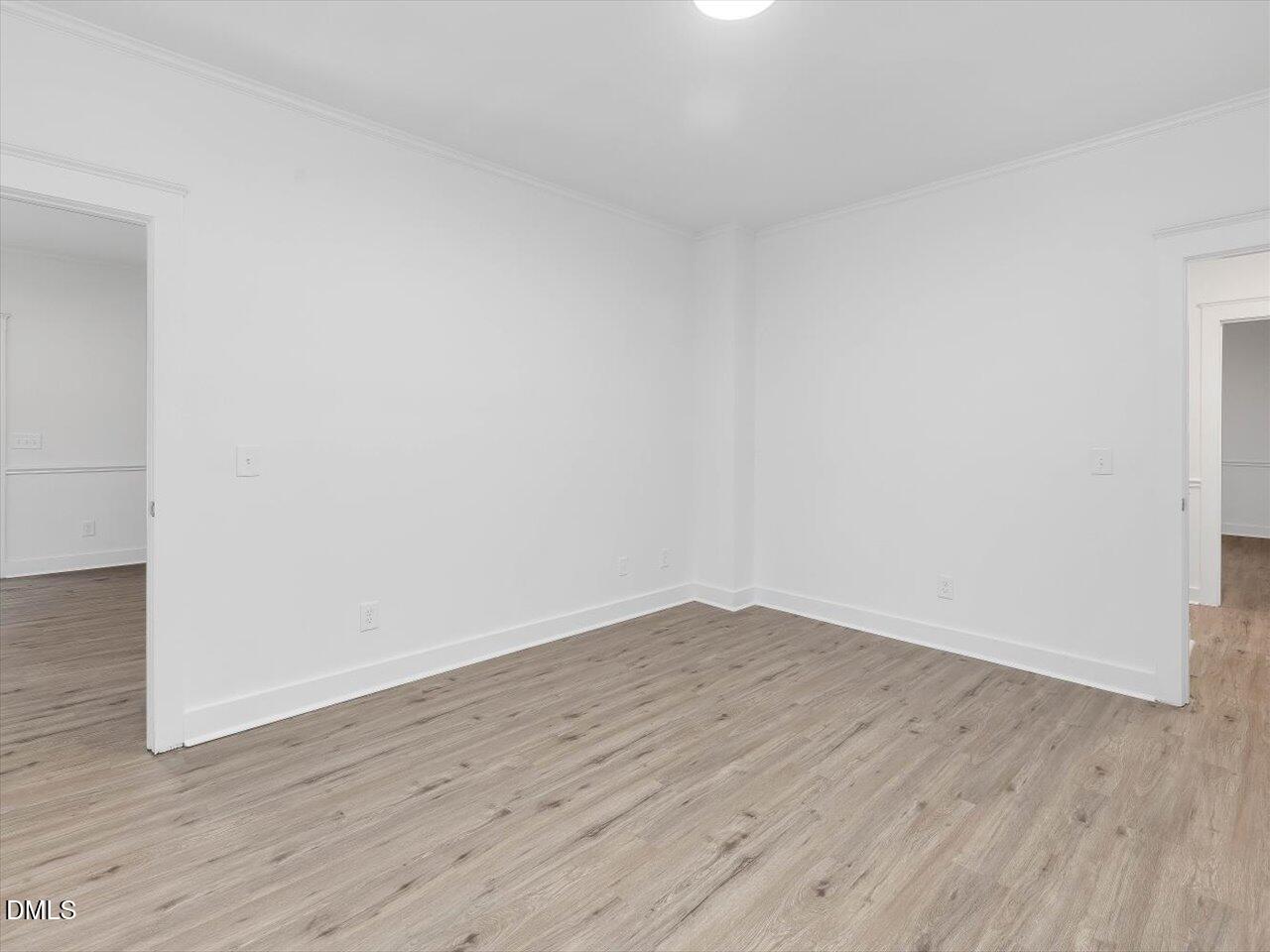 1838 Alex Cockman Road Pittsboro, NC 27312 - Photo 9 of 53 an empty room with wooden floor