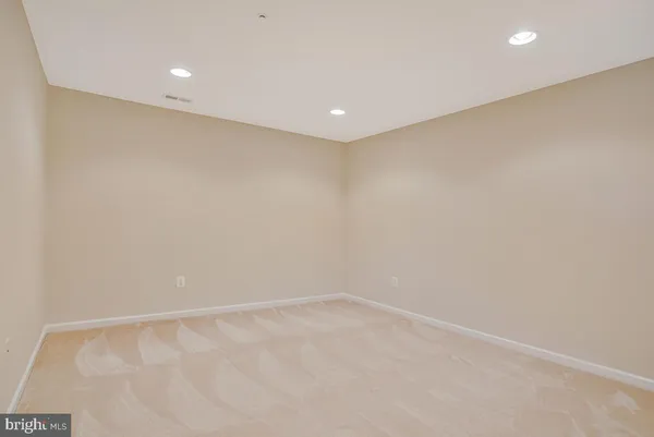 a picture of a room with a white wall and a painting