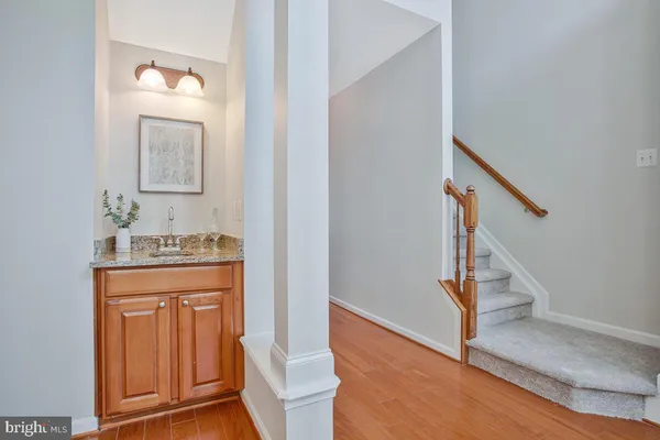 a kitchen with stainless steel appliances a stove a sink refrigerator and a microwave