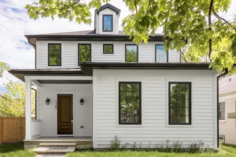 a front view of a house with garage