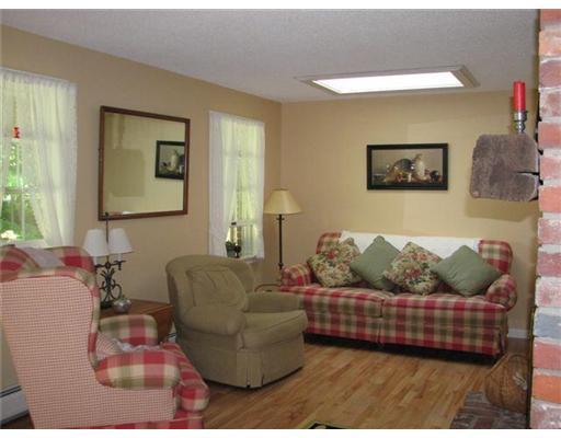348 Town Farm Road Oakland, ME 04963 - Photo 9 of 15 Living Room. With a gas fireplace...