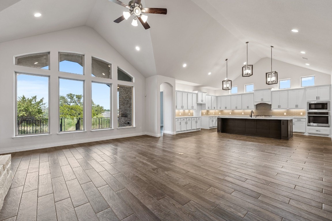 a view of kitchen with sink and wooden floor