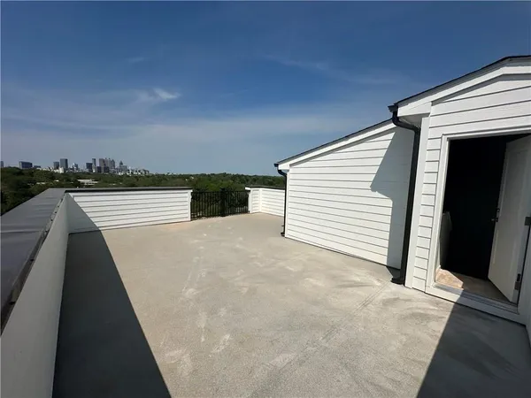a view of a house with car parked