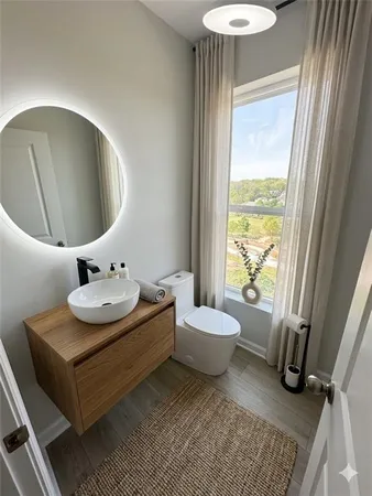 a stove top oven sitting inside of a kitchen