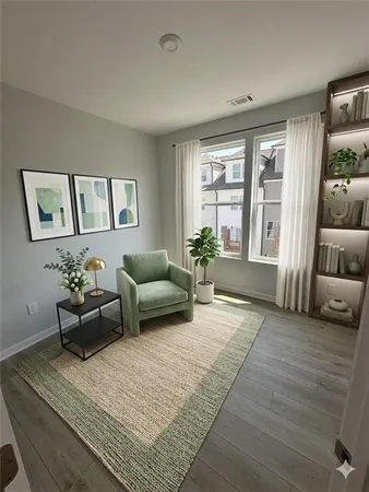 a large kitchen with stainless steel appliances granite countertop a large counter top and a wooden floors