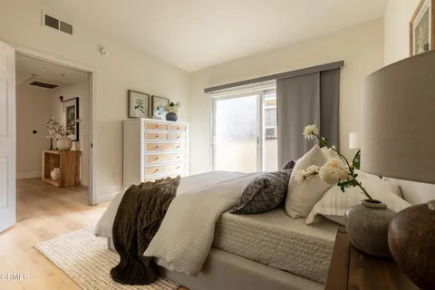 a bedroom with a bed and walk in closet