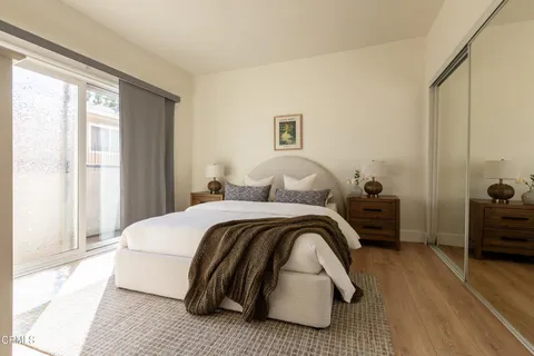 a bedroom with a bed and a view of bathroom