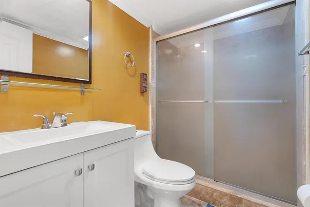 a bathroom with a sink toilet and vanity