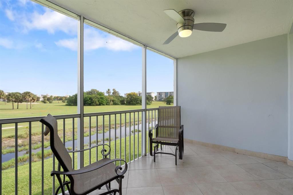 3001 South Palm Aire Drive, Unit 206 Pompano Beach, FL 33069 - Photo 20 of 31 a view of a balcony with furniture