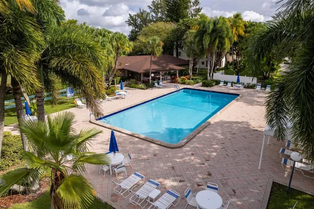 a view of a patio with swimming pool