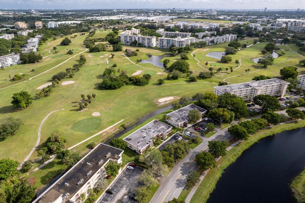 3001 South Palm Aire Drive, Unit 206 Pompano Beach, FL 33069 - Photo 25 of 31 an aerial view of residential houses with outdoor space