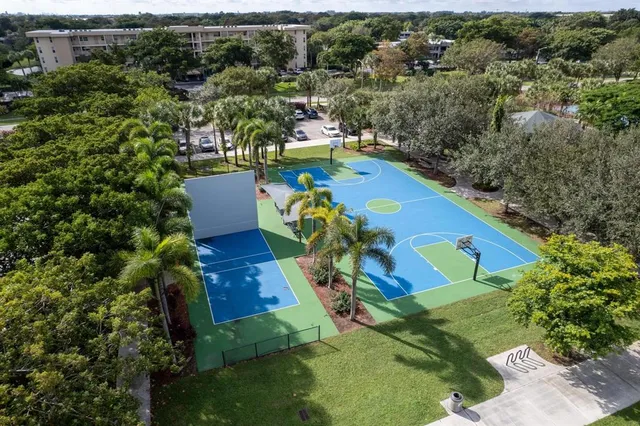 an aerial view of a house with a swimming pool patio and lake view