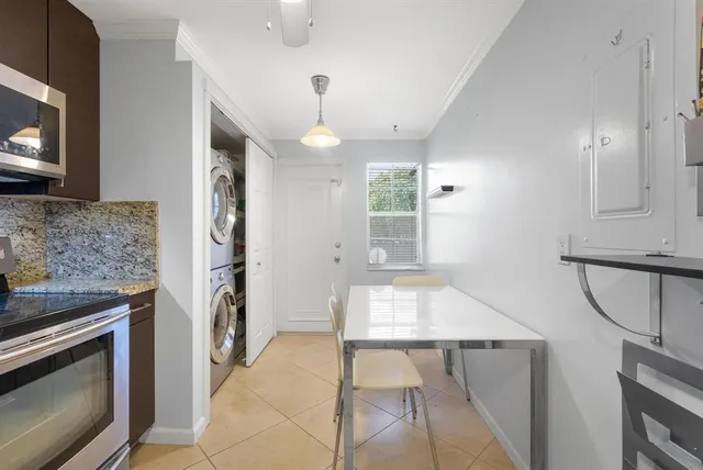 a kitchen with a stove and a fireplace