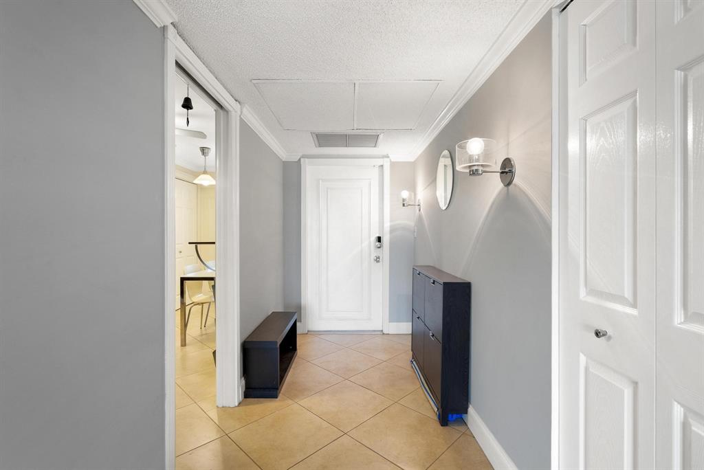 3001 South Palm Aire Drive, Unit 206 Pompano Beach, FL 33069 - Photo 6 of 31 a view of a hallway with walk in closet