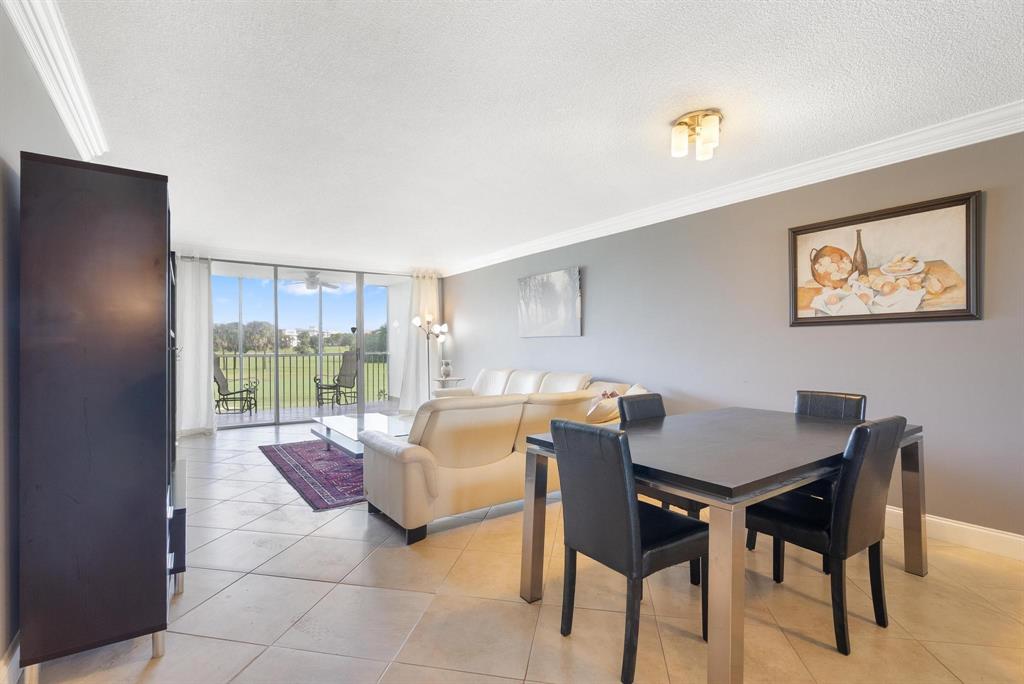 3001 South Palm Aire Drive, Unit 206 Pompano Beach, FL 33069 - Photo 7 of 31 a outdoor space with furniture