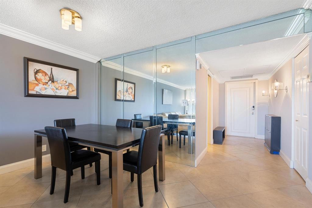 3001 South Palm Aire Drive, Unit 206 Pompano Beach, FL 33069 - Photo 8 of 31 a view of a dining room with furniture