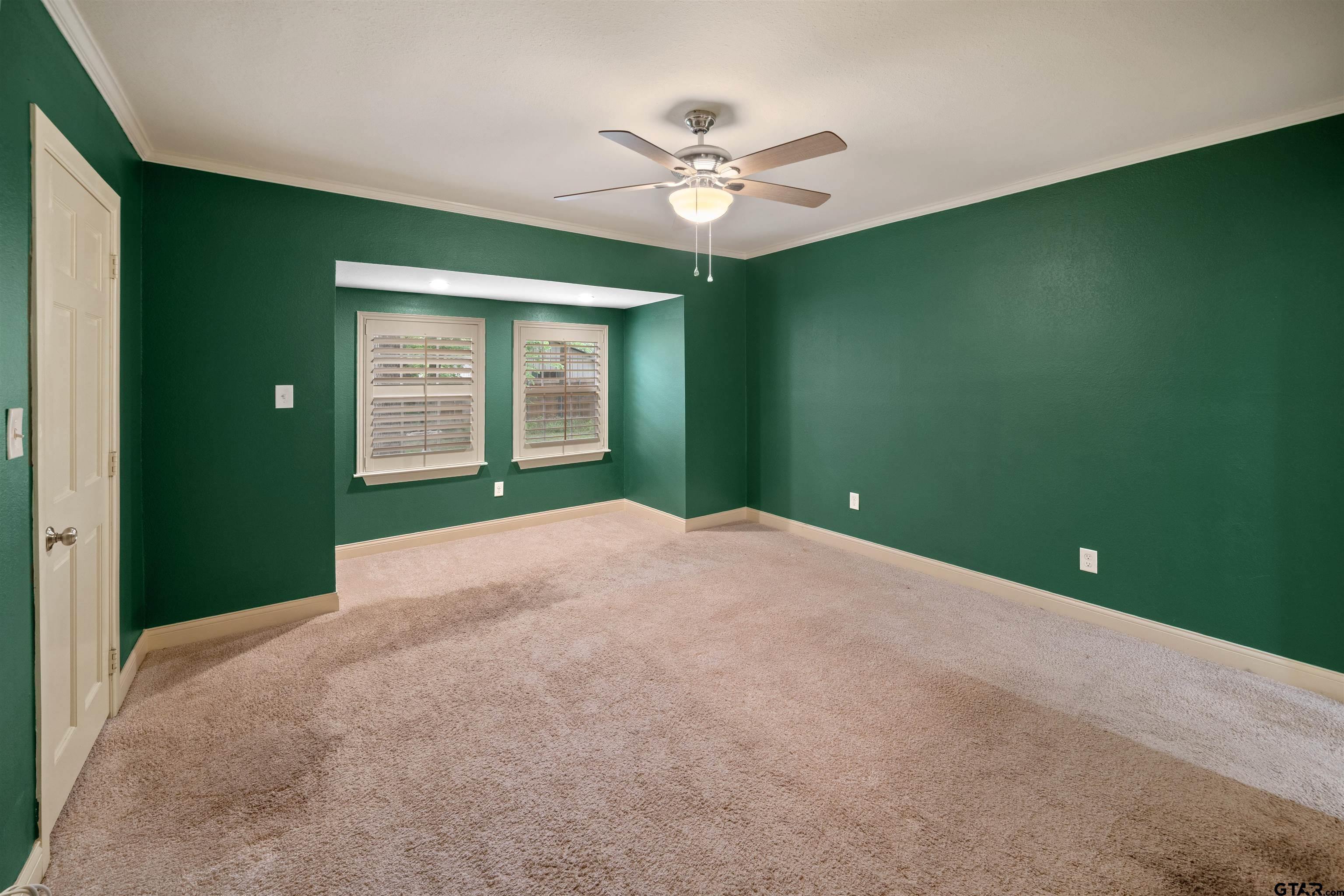 711 South Prairieville Street Athens, TX 75751 - Photo 16 of 27 a view of a livingroom with a ceiling fan and window
