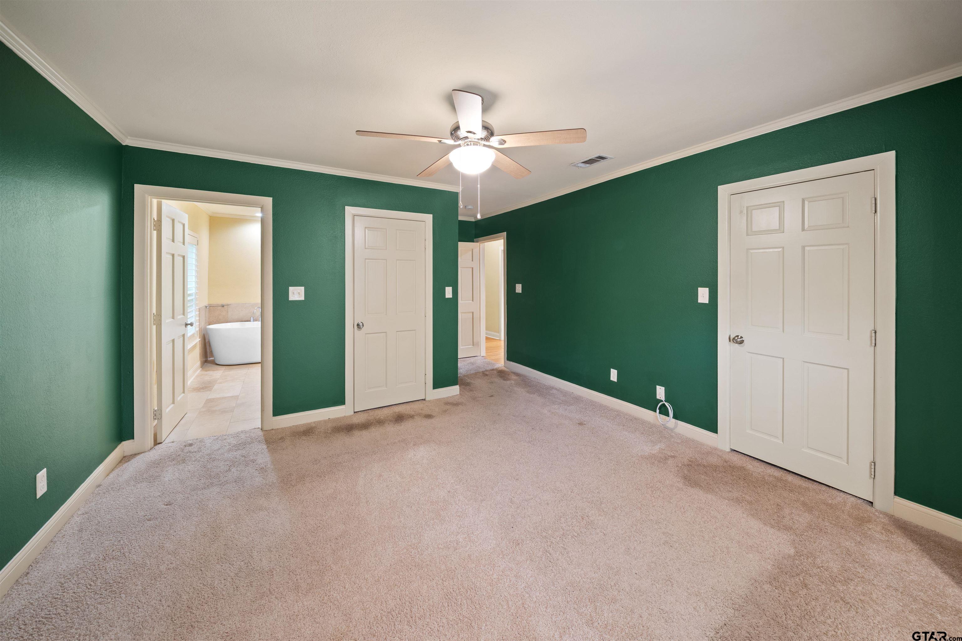 711 South Prairieville Street Athens, TX 75751 - Photo 17 of 27 a view of a livingroom with a ceiling fan and a chandelier fan