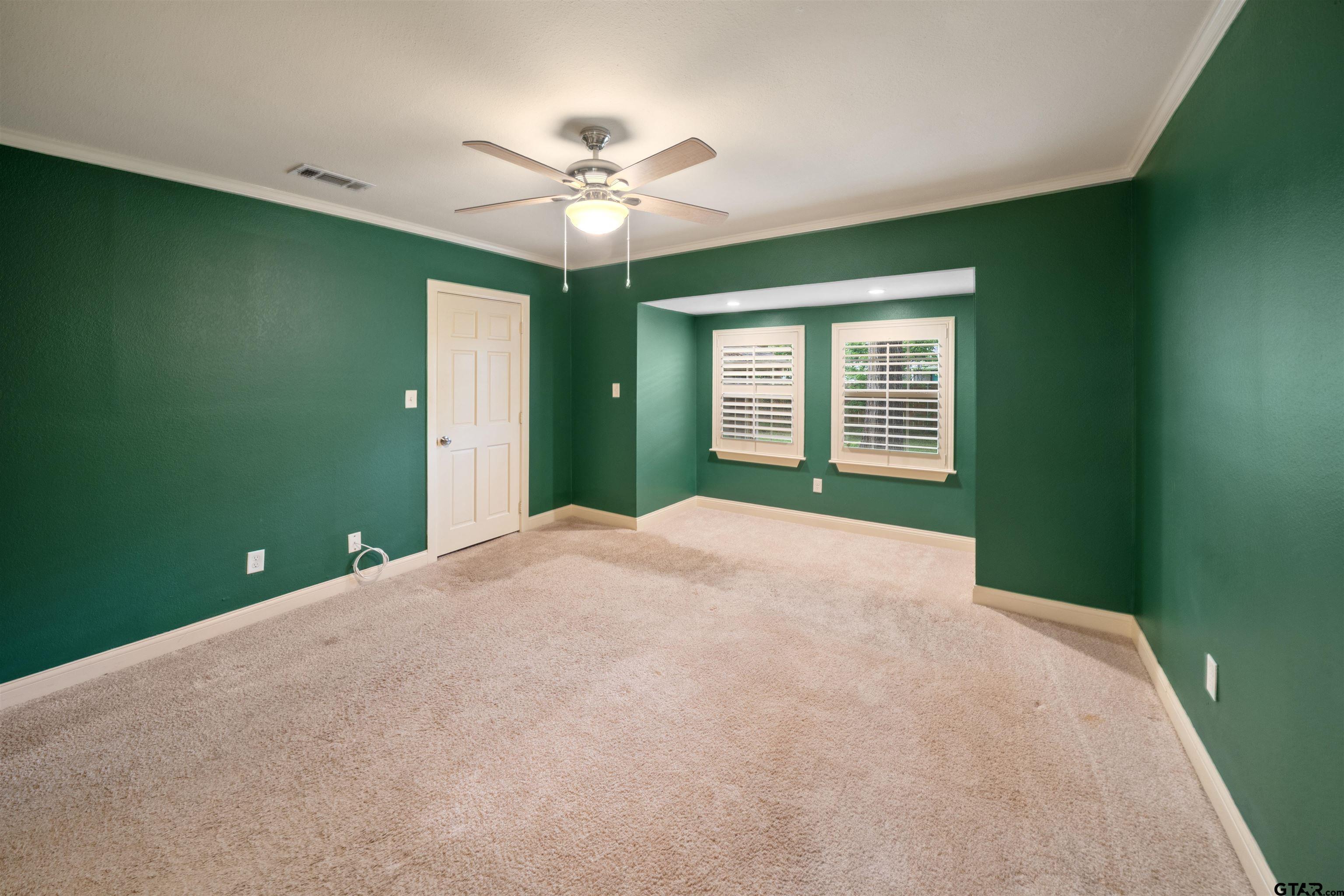 711 South Prairieville Street Athens, TX 75751 - Photo 18 of 27 a view of a livingroom with a ceiling fan and window
