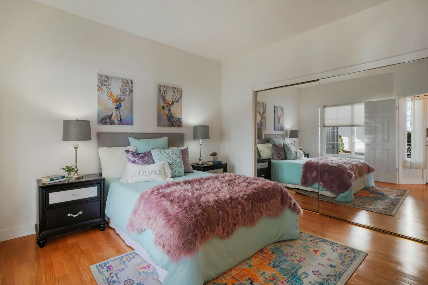 45 Outlook Circle Pacifica, CA 94044 - Photo 12 of 42 a bedroom with a bed and wooden floor