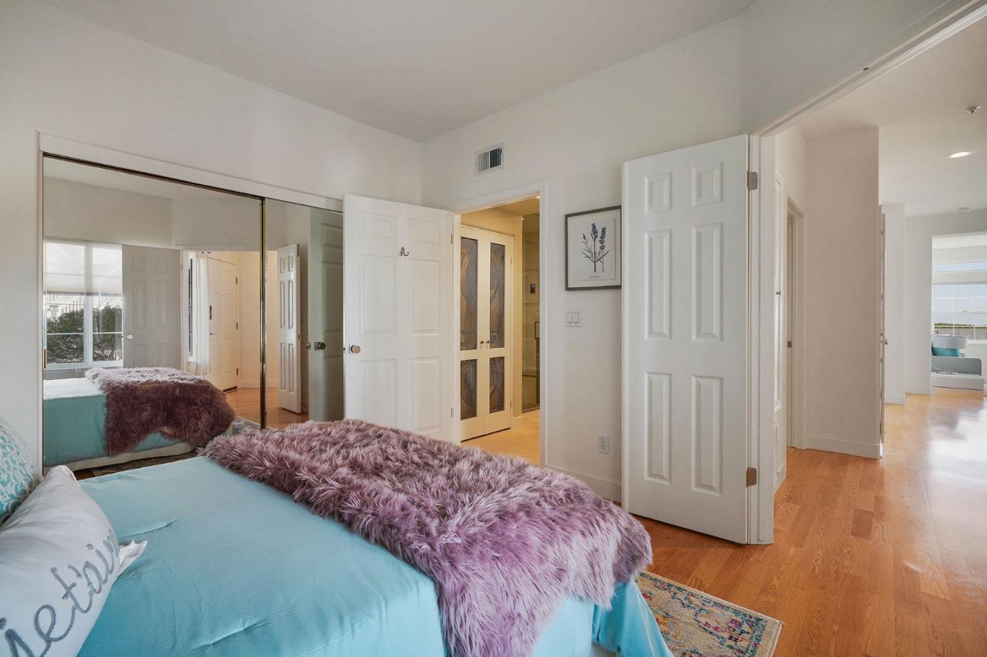 45 Outlook Circle Pacifica, CA 94044 - Photo 13 of 42 a bedroom with a bed closet and a large mirror