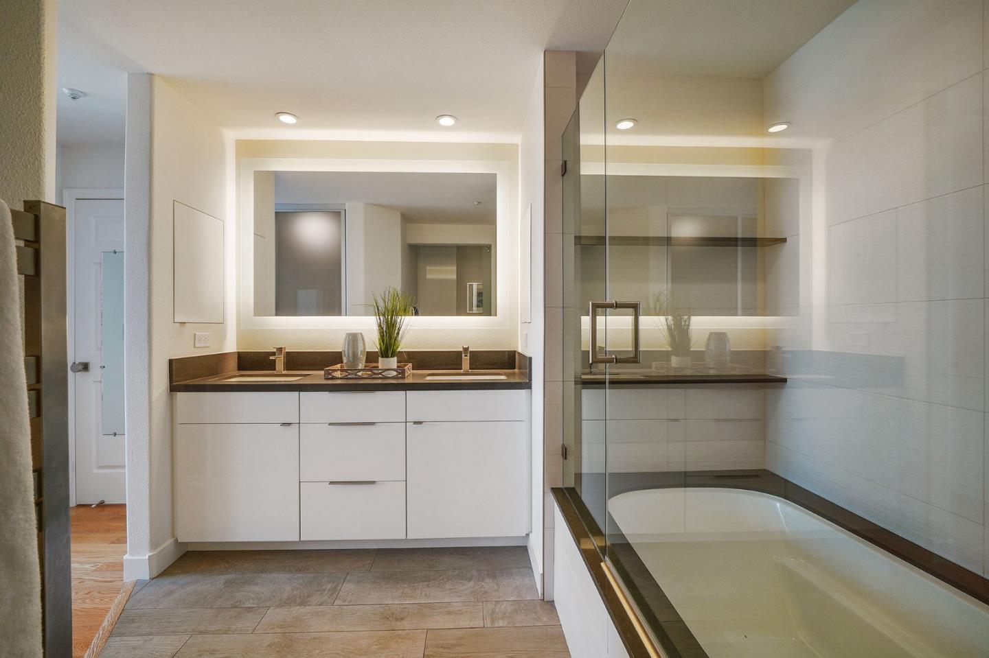 45 Outlook Circle Pacifica, CA 94044 - Photo 21 of 42 a bathroom with a granite countertop sink mirror and bathtub