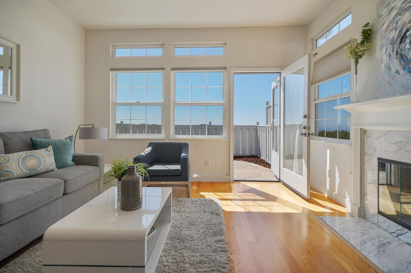 45 Outlook Circle Pacifica, CA 94044 - Photo 5 of 42 a living room with furniture a fireplace and a table