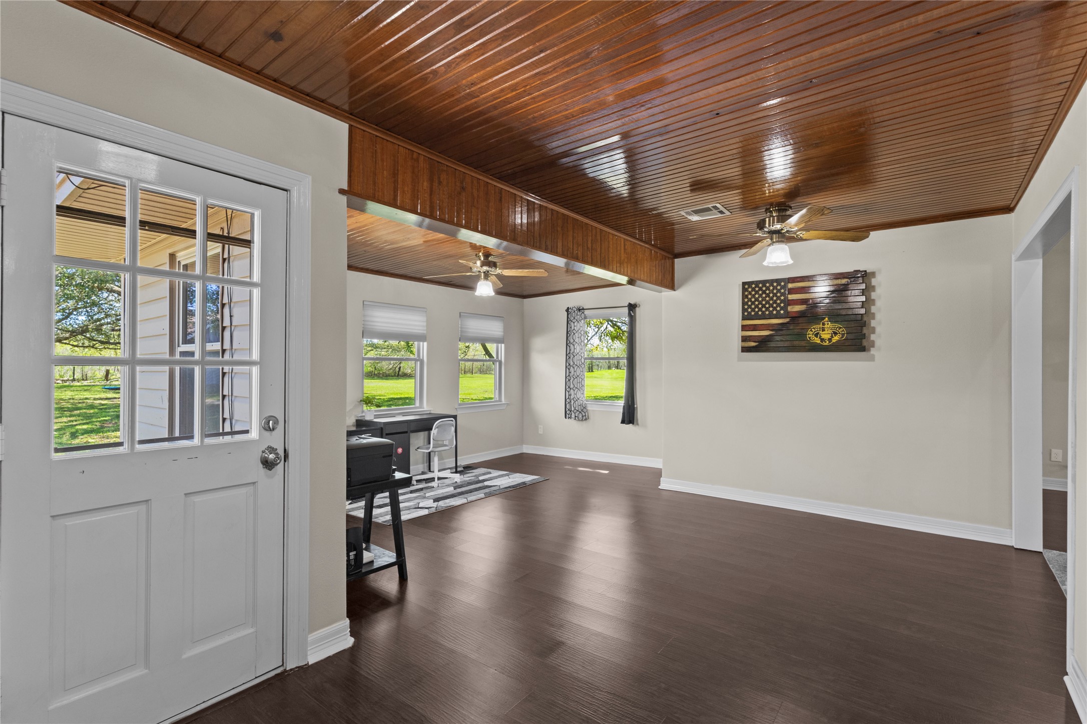 11546 Davidson Road Beaumont, TX 77705 - Photo 14 of 40 a view of an empty room with wooden floor and a window