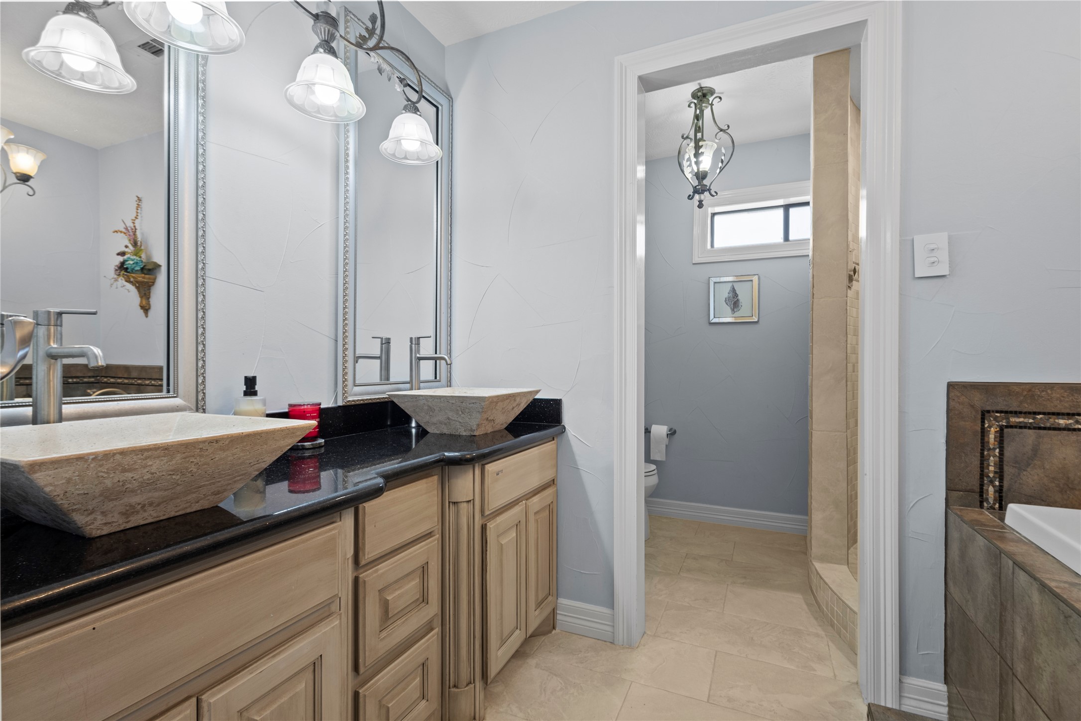 11546 Davidson Road Beaumont, TX 77705 - Photo 23 of 40 a bathroom with a granite countertop sink and a mirror