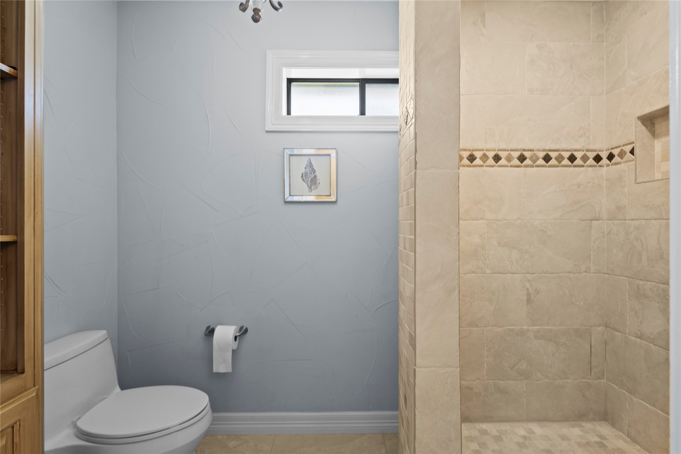 11546 Davidson Road Beaumont, TX 77705 - Photo 25 of 40 a white toilet sitting next to a bathroom sink and vanity