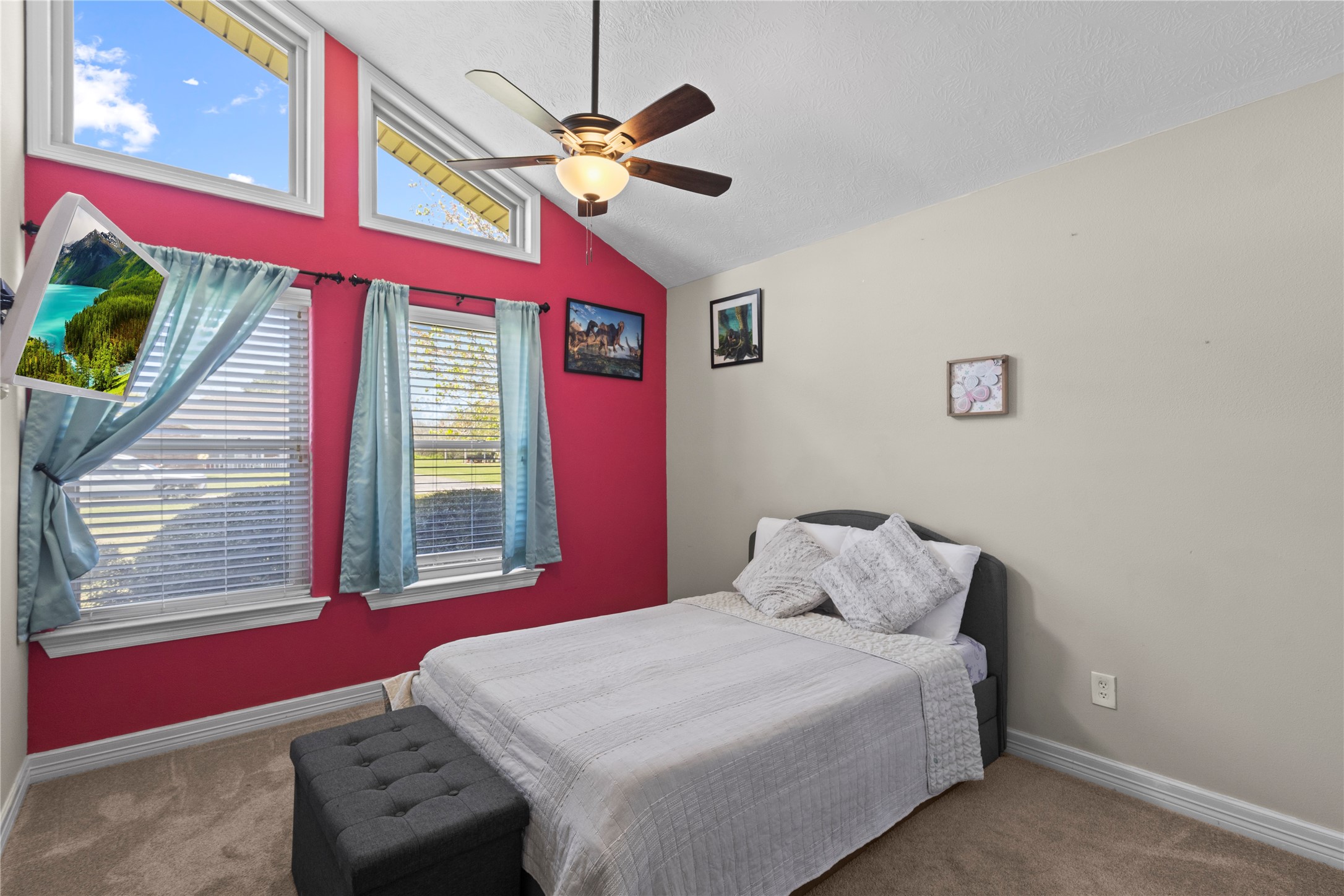 11546 Davidson Road Beaumont, TX 77705 - Photo 28 of 40 a bedroom with a bed and a chandelier