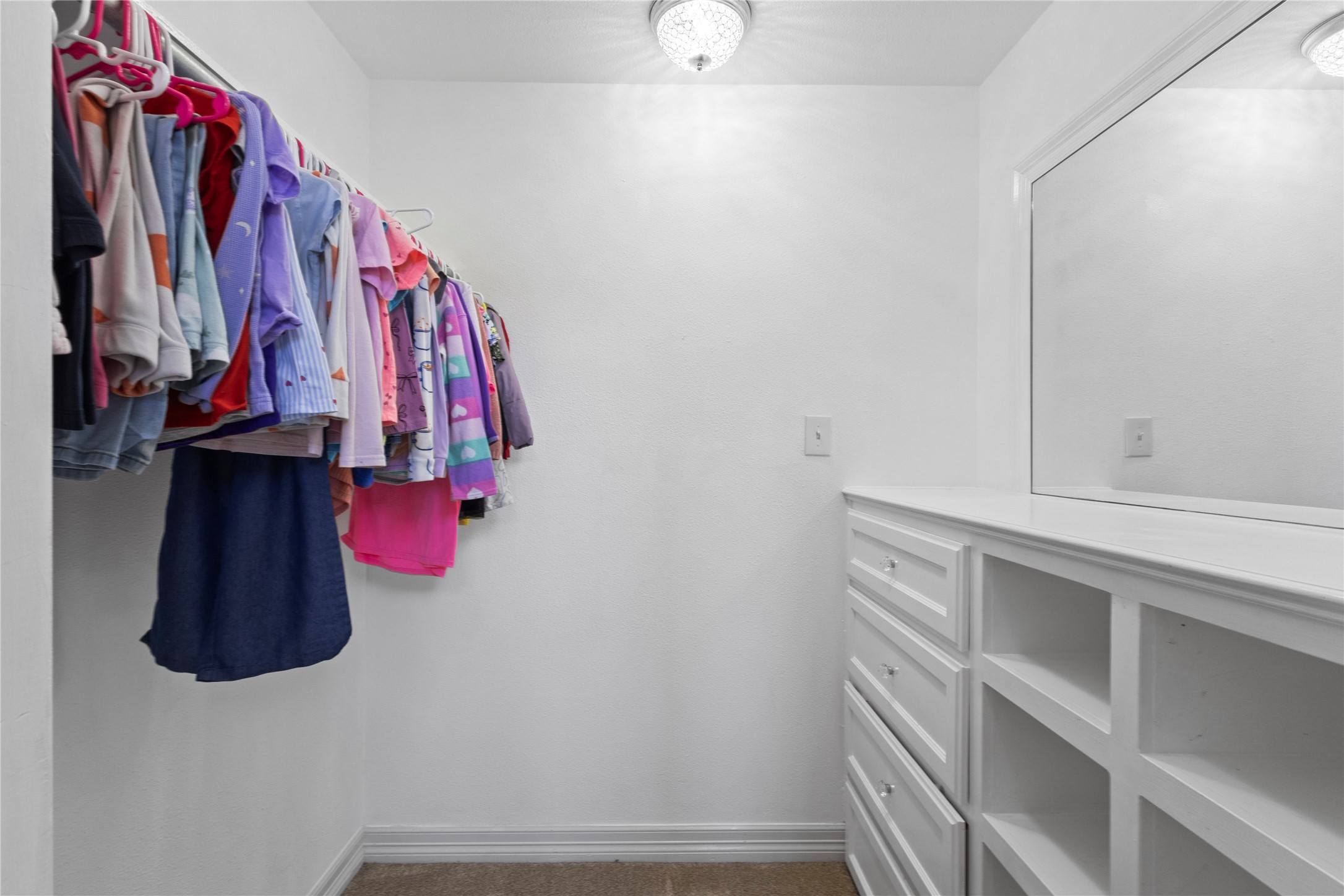 11546 Davidson Road Beaumont, TX 77705 - Photo 29 of 40 a view of walk in closet with clothes