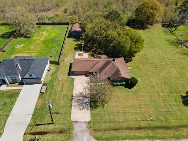 an aerial view of houses with swimming pool
