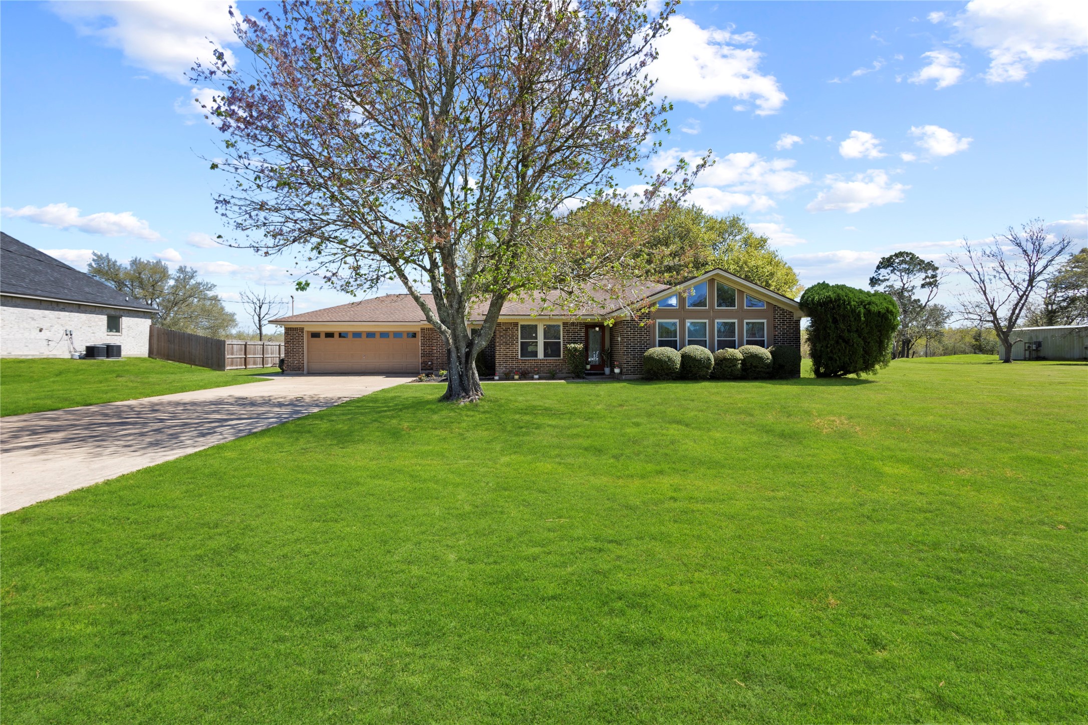 11546 Davidson Road Beaumont, TX 77705 - Photo 7 of 40 a view of a house with a big yard and large trees