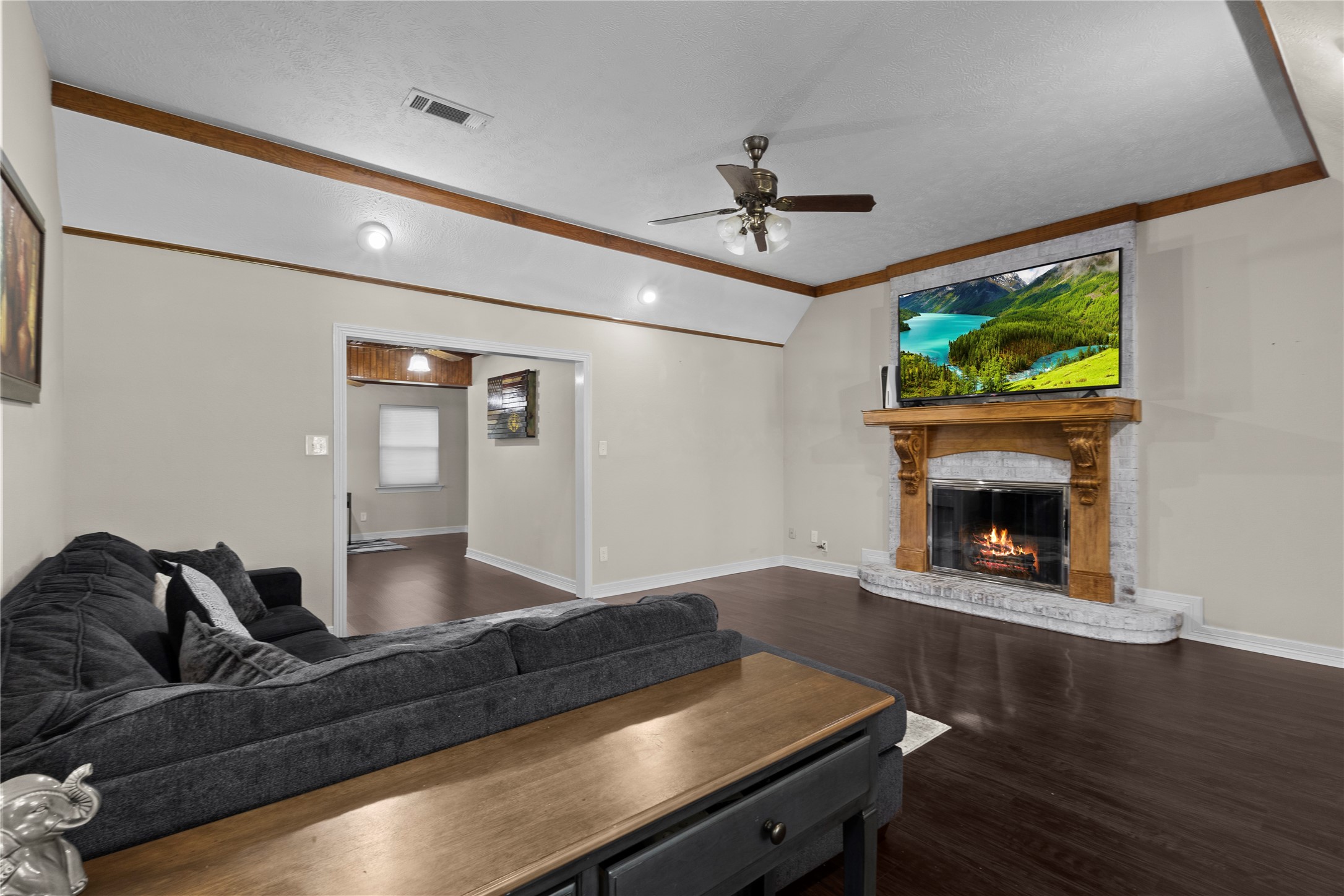 11546 Davidson Road Beaumont, TX 77705 - Photo 10 of 40 a living room with furniture and a fireplace