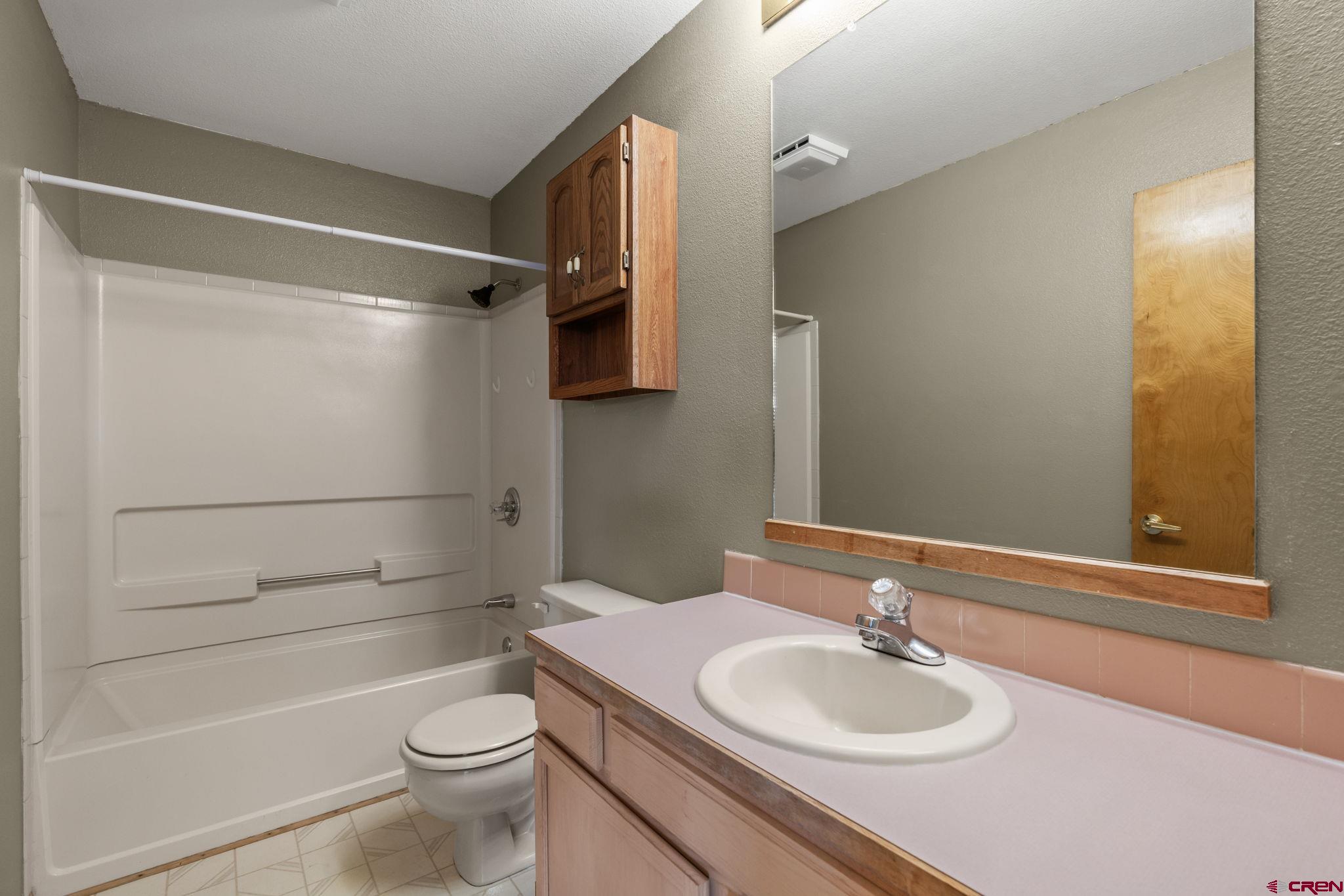 720 Sawmill Road Durango, CO 81303 - Photo 15 of 41 a bathroom with a sink a toilet and shower
