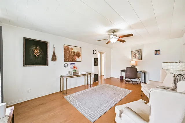 a living room with furniture and a table
