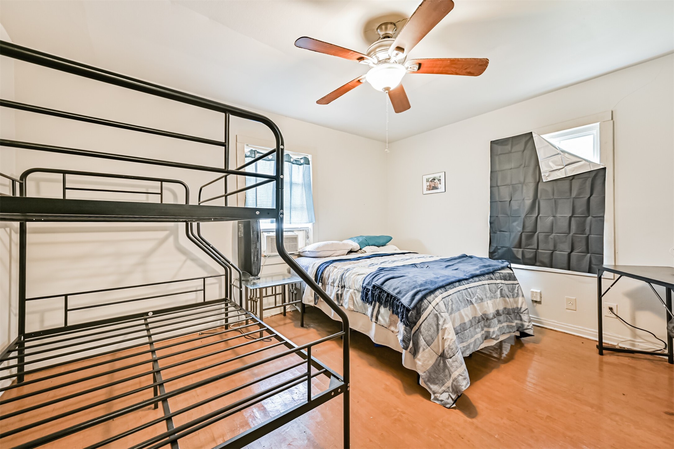 707 West 5th Street Freeport, TX 77541 - Photo 6 of 18 a bedroom with a bed and a chandelier