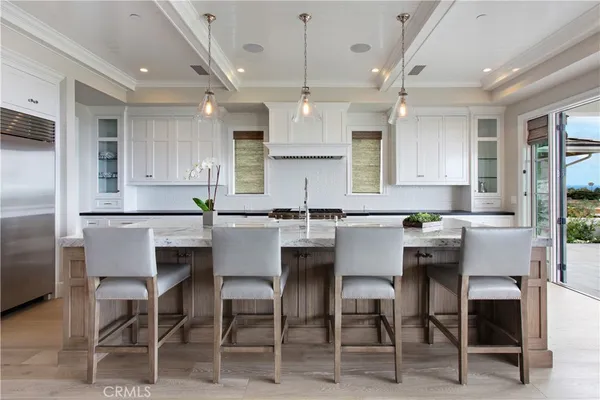 a view of kitchen island a sink and living room