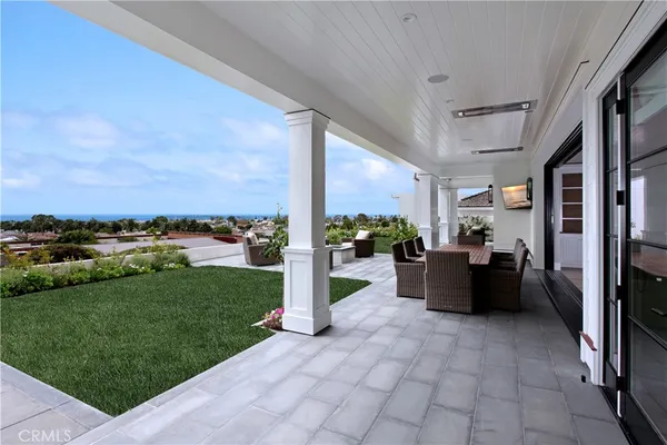 a front view of a house with swimming pool having outdoor seating