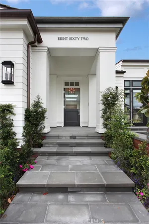 a view of entryway with flower pots