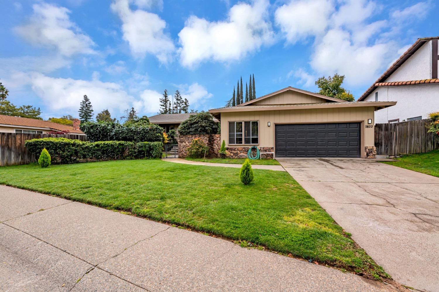 7822 Tamara Drive Fair Oaks, CA 95628 - Photo 1 of 28 a front view of a house with a yard and entertaining space