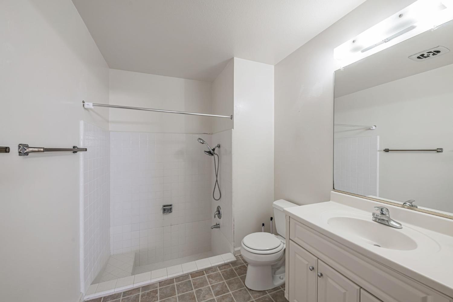 7822 Tamara Drive Fair Oaks, CA 95628 - Photo 11 of 28 a bathroom with a sink a toilet and shower