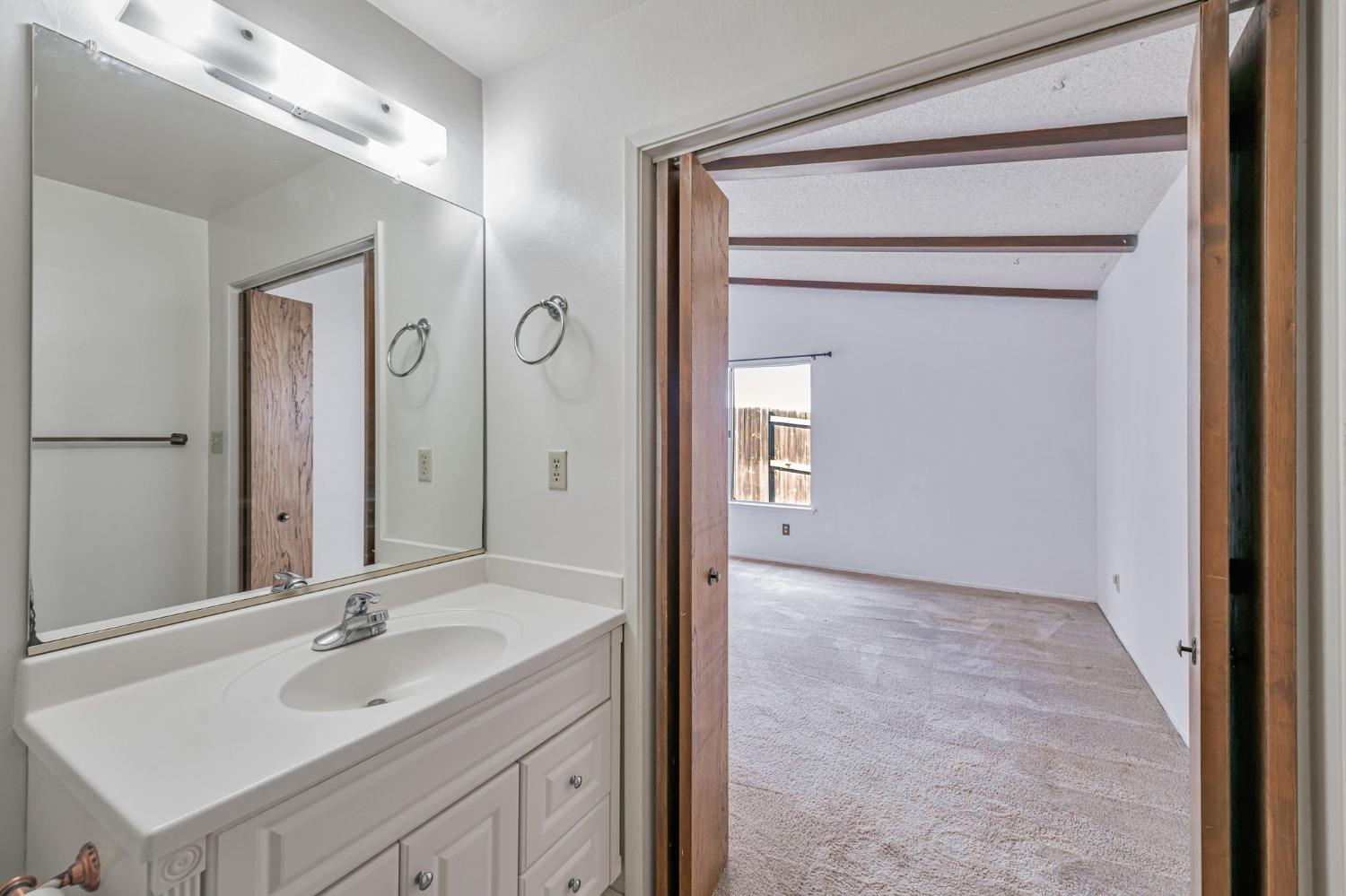 7822 Tamara Drive Fair Oaks, CA 95628 - Photo 12 of 28 a bathroom with a sink and a mirror