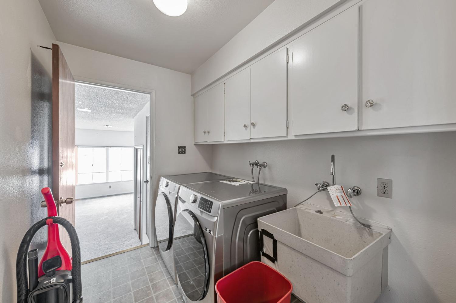 7822 Tamara Drive Fair Oaks, CA 95628 - Photo 20 of 28 a utility room with sink dryer and washer