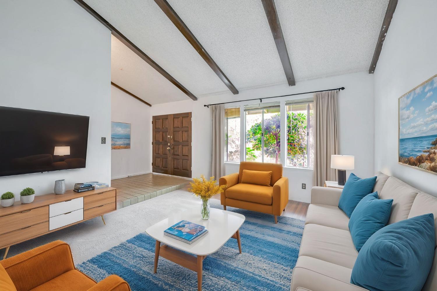 7822 Tamara Drive Fair Oaks, CA 95628 - Photo 24 of 28 a living room with furniture and a flat screen tv