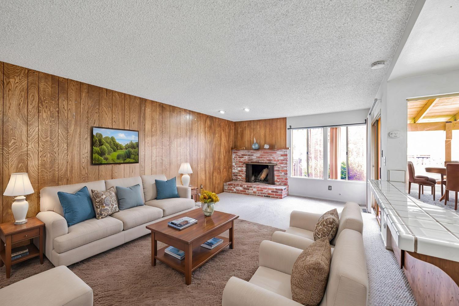 7822 Tamara Drive Fair Oaks, CA 95628 - Photo 25 of 28 a living room with furniture and a fireplace